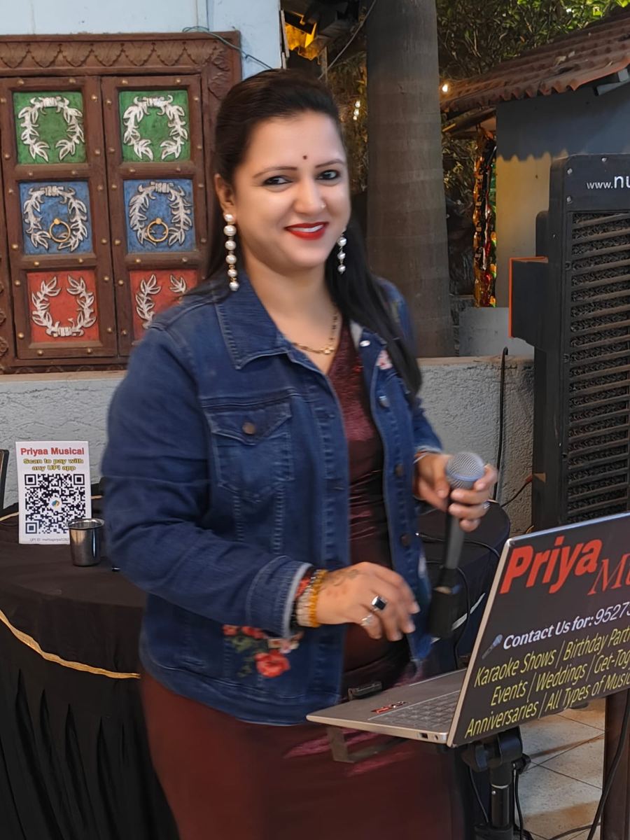 Priya singing with microphone