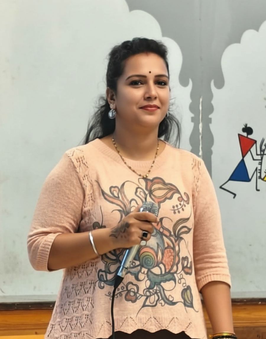 Priya smiling in casual portrait