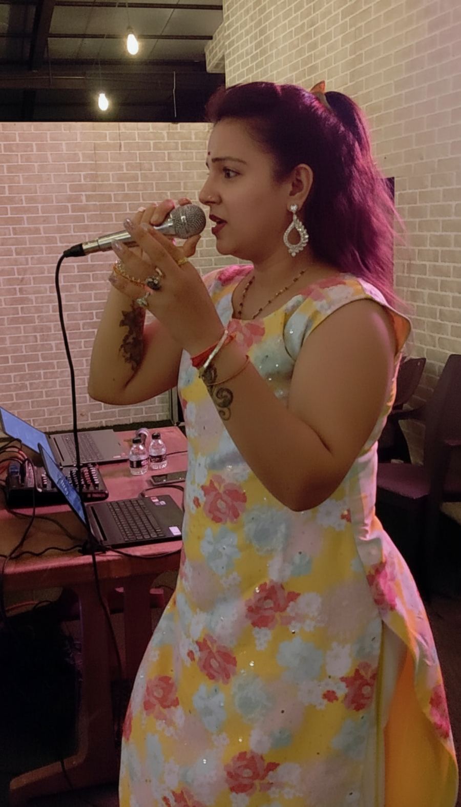 Priya singing with sound mixer
