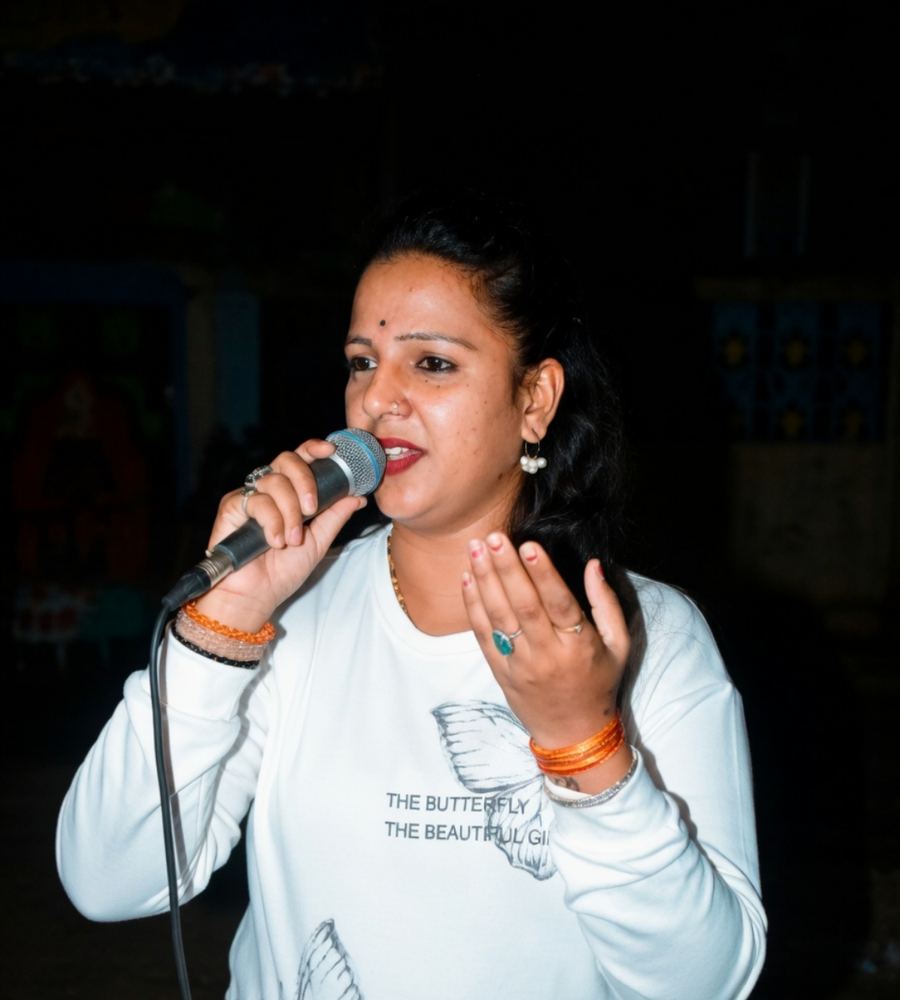 Priya performing with expressive vocals